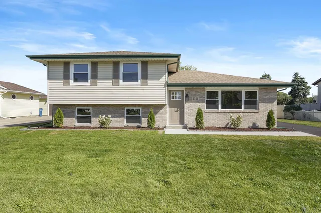 a house view with a garden space