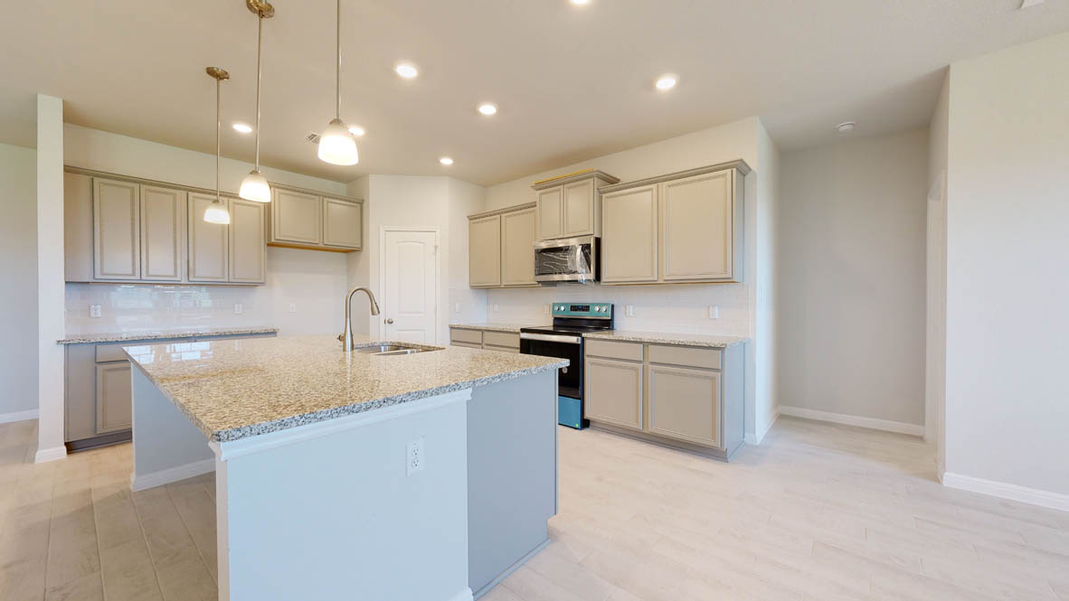604 Gauge Road Thorndale, TX 76577 - Photo 7 of 31 a kitchen with a sink stove cabinets and refrigerator