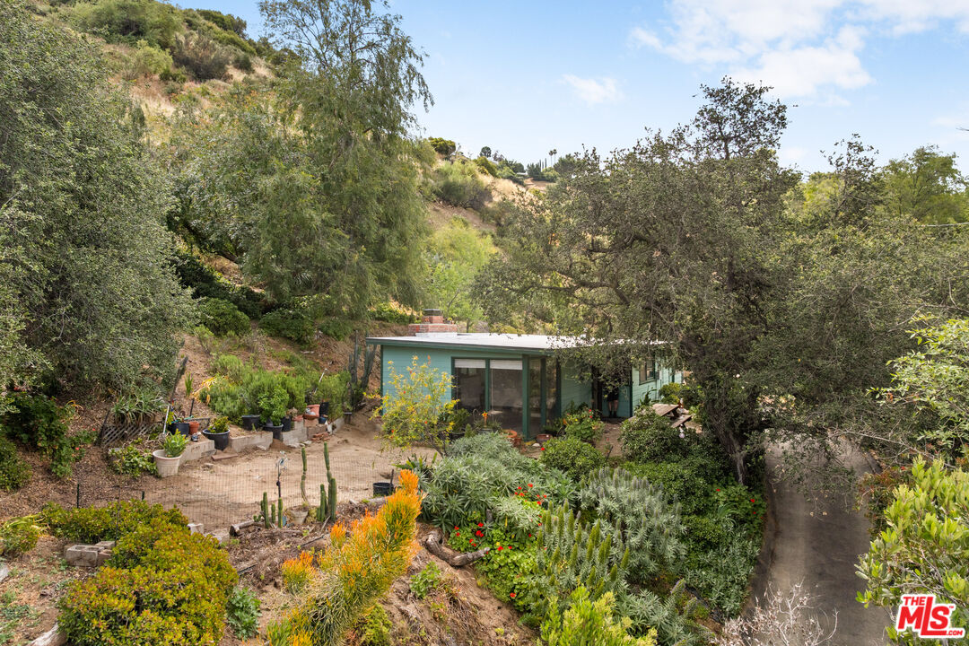 9738 Commerce Avenue Tujunga, CA 91042 - Photo 1 of 17 a view of a house with a yard