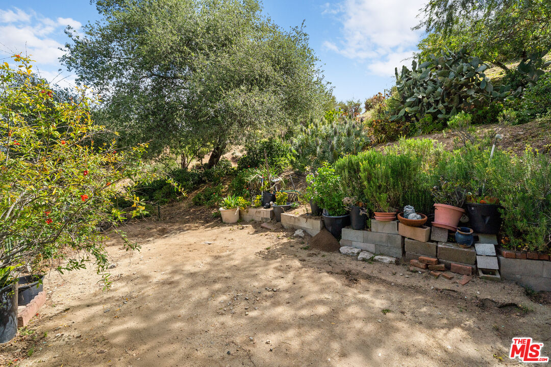 9738 Commerce Avenue Tujunga, CA 91042 - Photo 12 of 17 a view of a backyard with sitting area