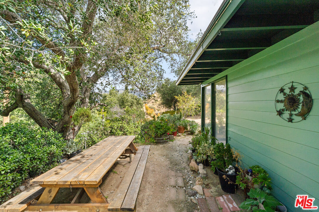 9738 Commerce Avenue Tujunga, CA 91042 - Photo 10 of 17 a view of a backyard with potted plants