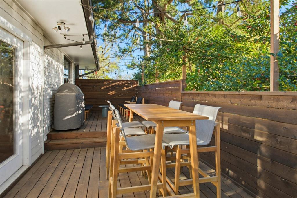 1014 Evergreen Hills Road Dallas, TX 75208 - Photo 12 of 12 a terrace with outdoor seating and wooden floor