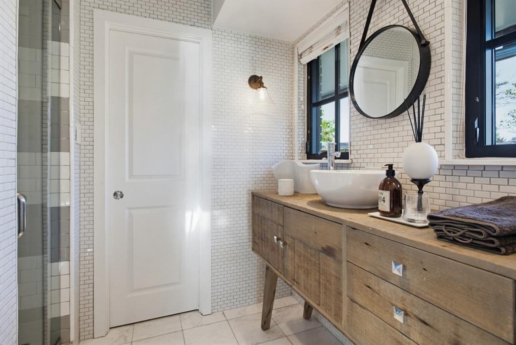 1014 Evergreen Hills Road Dallas, TX 75208 - Photo 9 of 12 a bathroom with a sink and a mirror