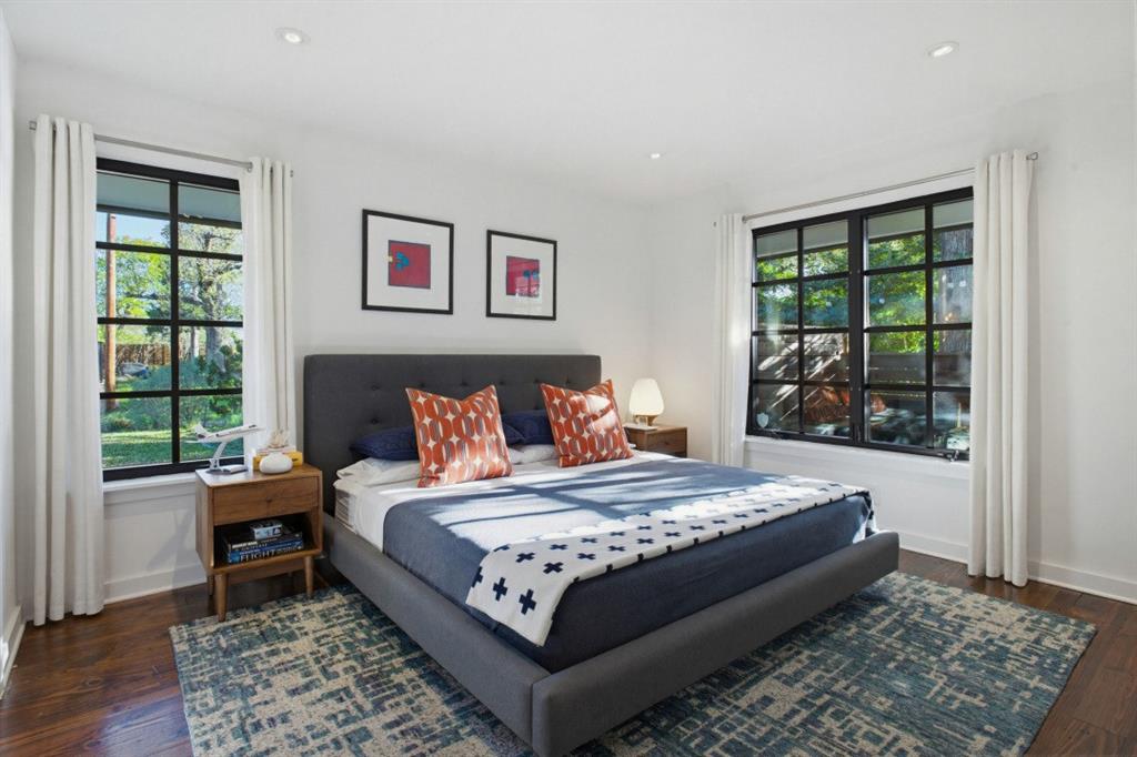 1014 Evergreen Hills Road Dallas, TX 75208 - Photo 10 of 12 a bed sitting in a bedroom next to a window