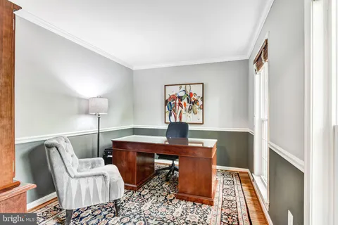 a work room with furniture and wooden floor