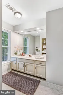 a bathroom with a bathtub and a sink