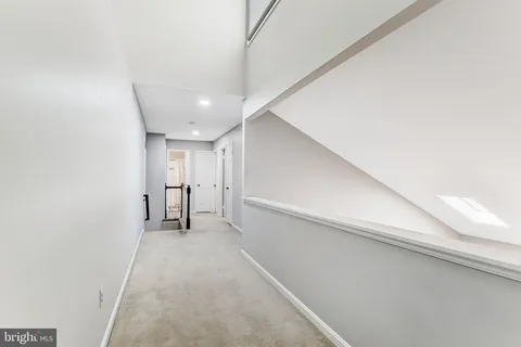 a bathroom with a sink toilet a mirror and shower
