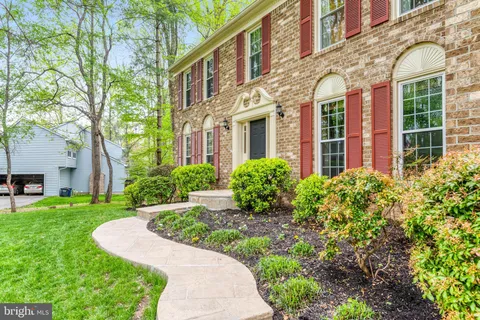 a view of a brick building next to a yard
