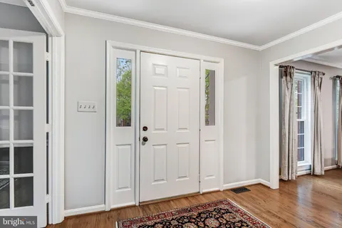 wooden floor with white walls