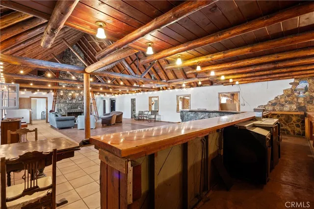 a view of a livingroom with couch and a grill