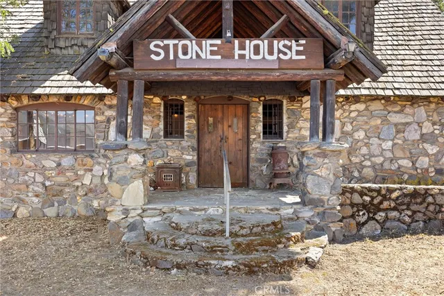 a view of a brick house with large windows