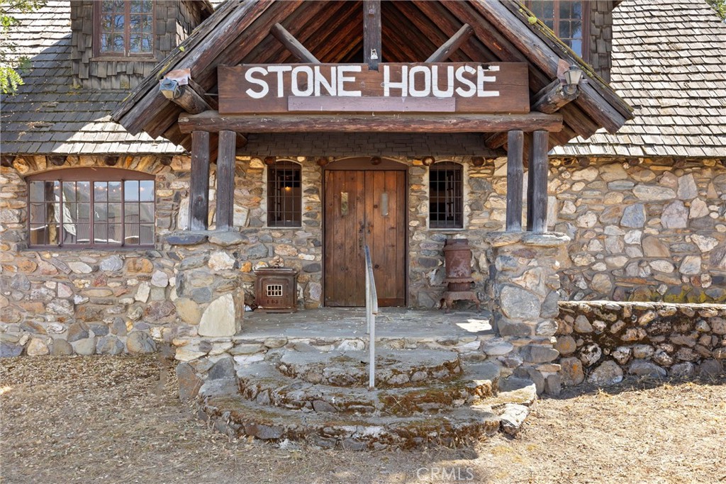1918 East Main Street Quincy, CA 95971 - Photo 6 of 28 a view of a brick house with large windows