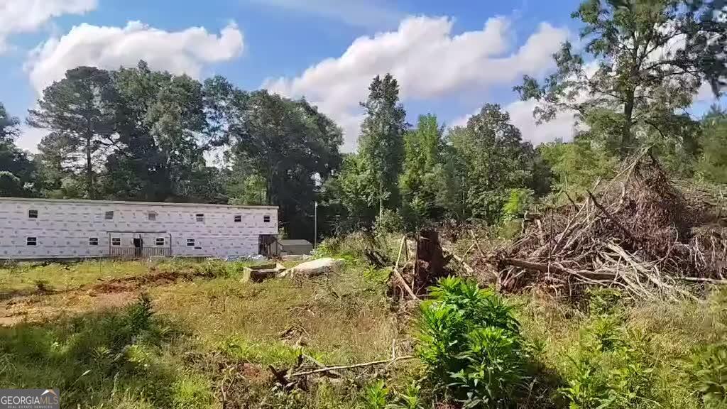 125 Little Road Northwest Milledgeville, GA 31061 - Photo 3 of 5 a backyard of a house with lots of green space