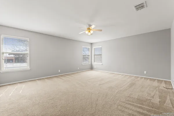 a view of an empty room with a window