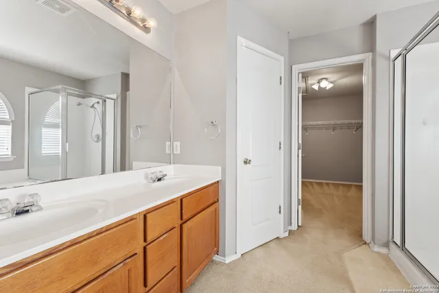 a bathroom with a tub sink and mirror