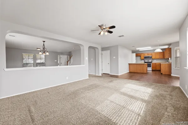 a view of livingroom with hardwood floor and a ceiling fan