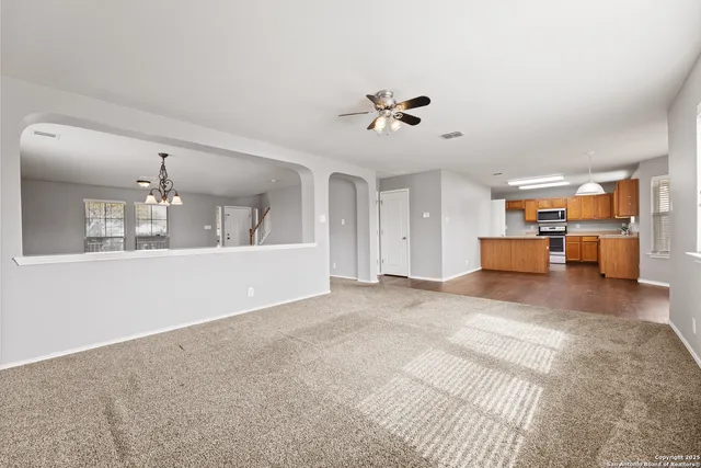 a view of livingroom with hardwood floor and a ceiling fan