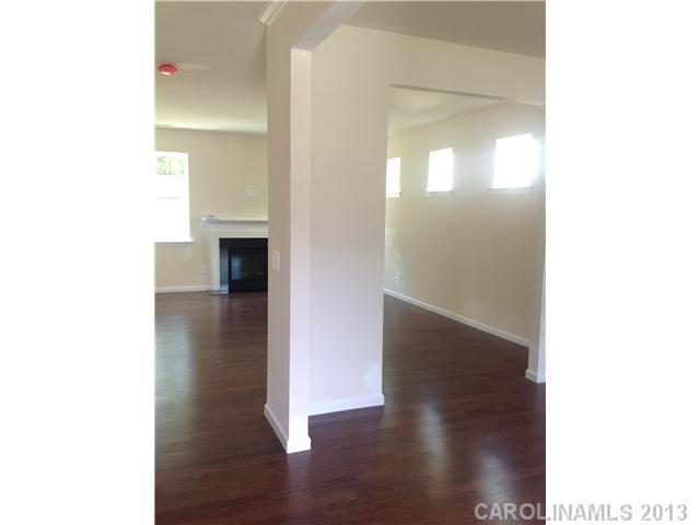 78119 Rillstone Drive, Unit 398 Lancaster, SC 29720 - Photo 3 of 13 a view of a hallway with wooden floor