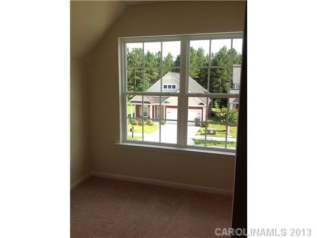 78119 Rillstone Drive, Unit 398 Lancaster, SC 29720 - Photo 8 of 13 a view of an empty room with a window