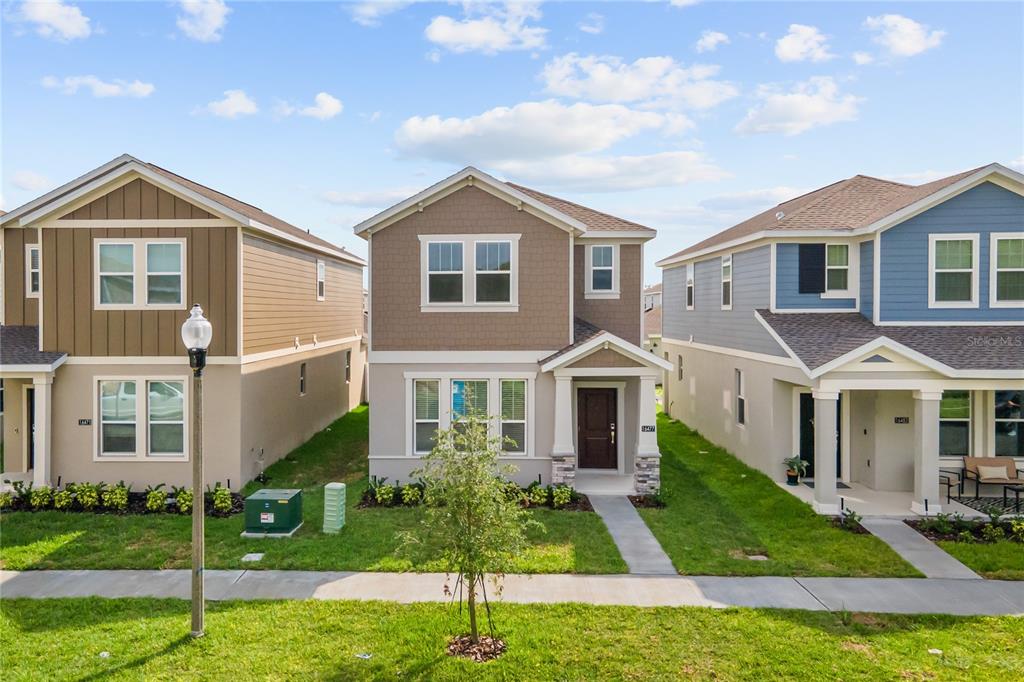 16477 Parable Way Winter Garden, FL 34787 - Photo 1 of 1 a front view of a house with a yard
