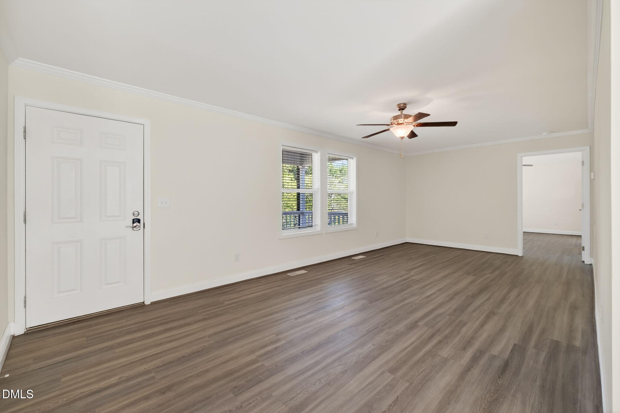 7122 Guess Road Hillsborough, NC 27278 - Photo 25 of 48 a view of an empty room with wooden floor and a window