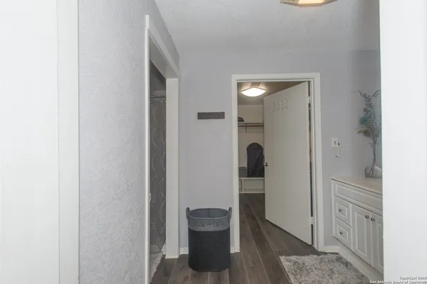 a bathroom with a sink vanity and mirror