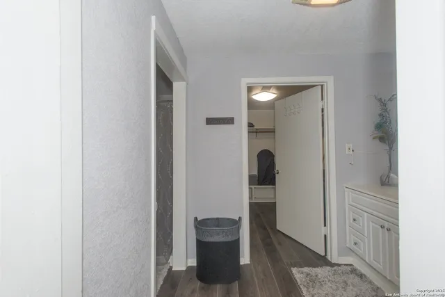 a bathroom with a sink vanity and mirror