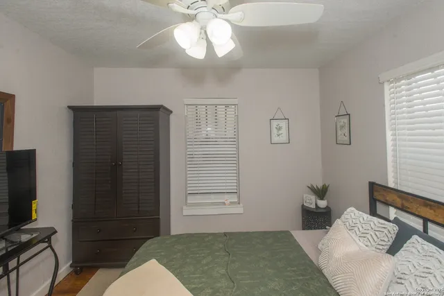 a bathroom with a shower a toilet and sink