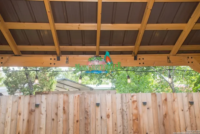 a view of patio with a table and chairs