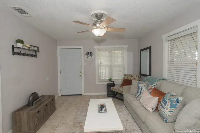 a living room with furniture and a couch