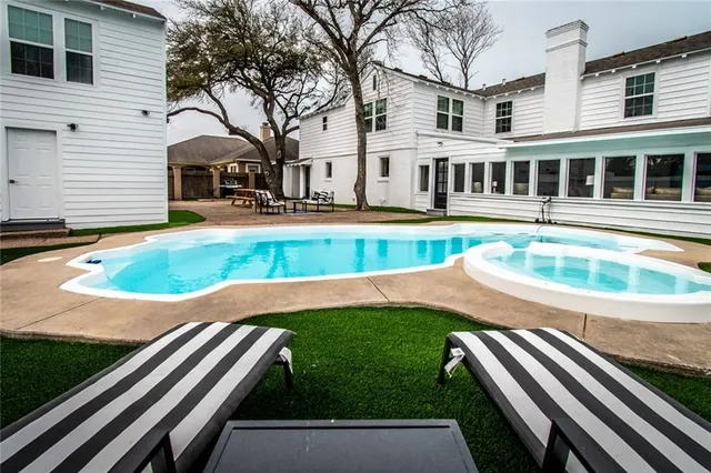 a view of a house with swimming pool