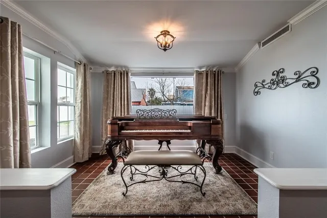 a view of a livingroom with furniture window and wooden floor