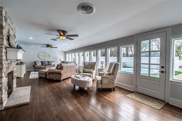 a living room with furniture and a large window