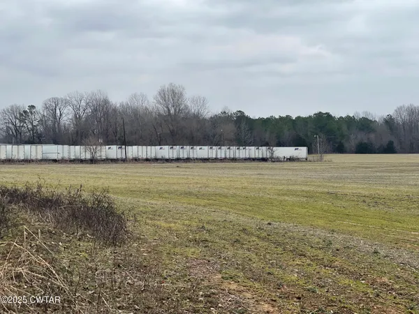 a view of a lake with houses in the back