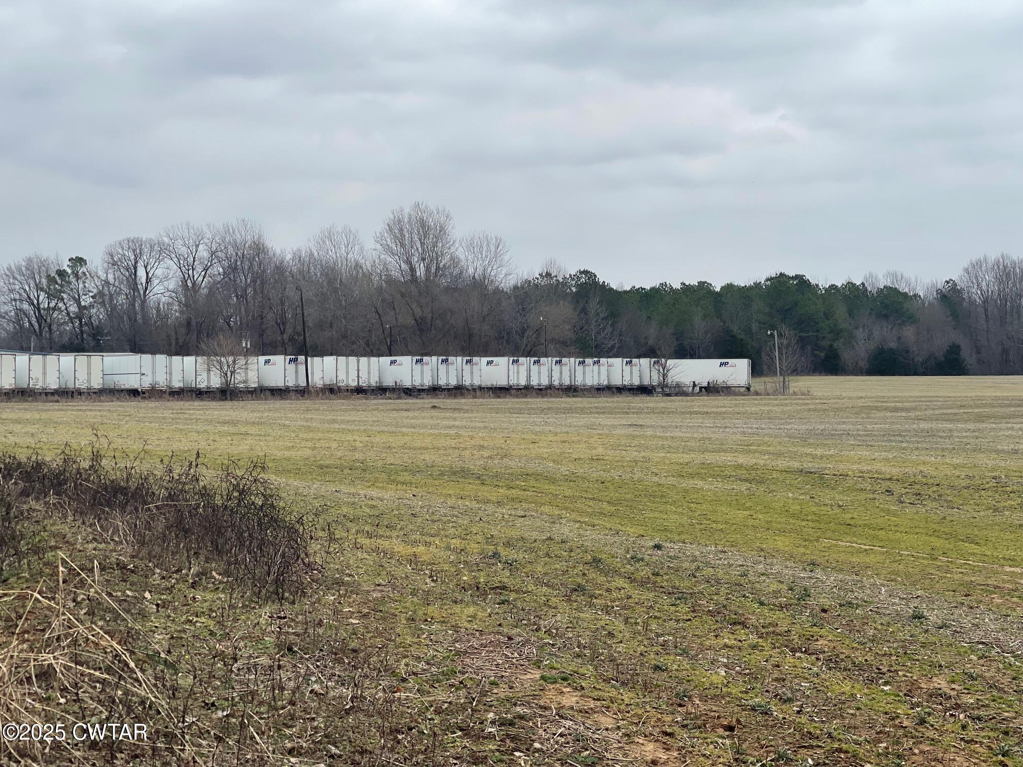 0 Hwy 70 & Browns Church Road Jackson, TN 38305 - Photo 14 of 23 a view of a lake with houses in the back