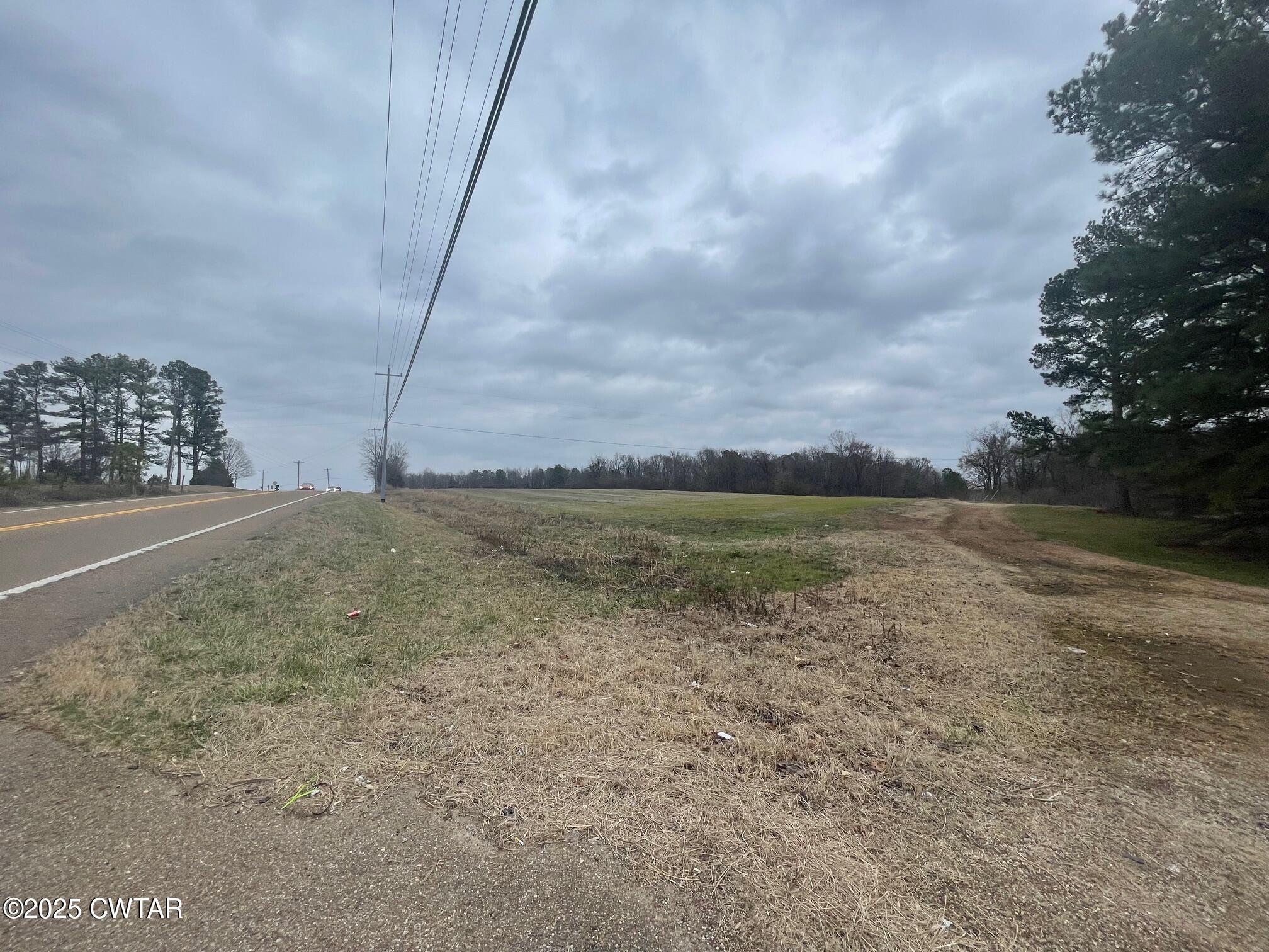 0 Hwy 70 & Browns Church Road Jackson, TN 38305 - Photo 18 of 23 a view of a dry yard with wooden fence
