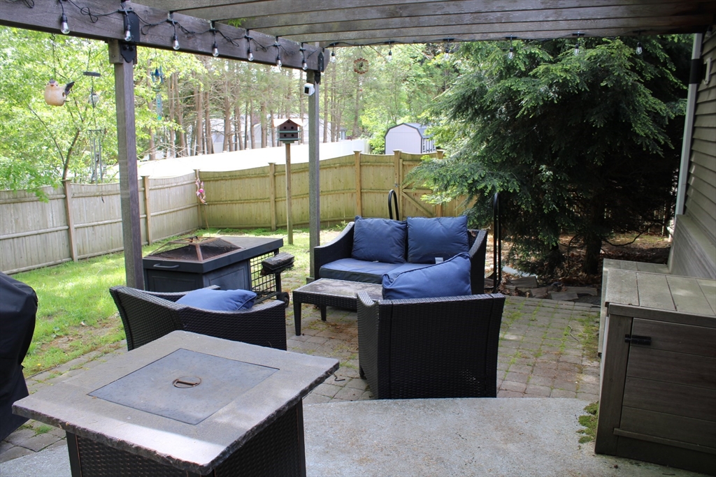 225 Braemoor Road Brockton, MA 02301 - Photo 9 of 29 a view of an outdoor sitting area with furniture and a yard