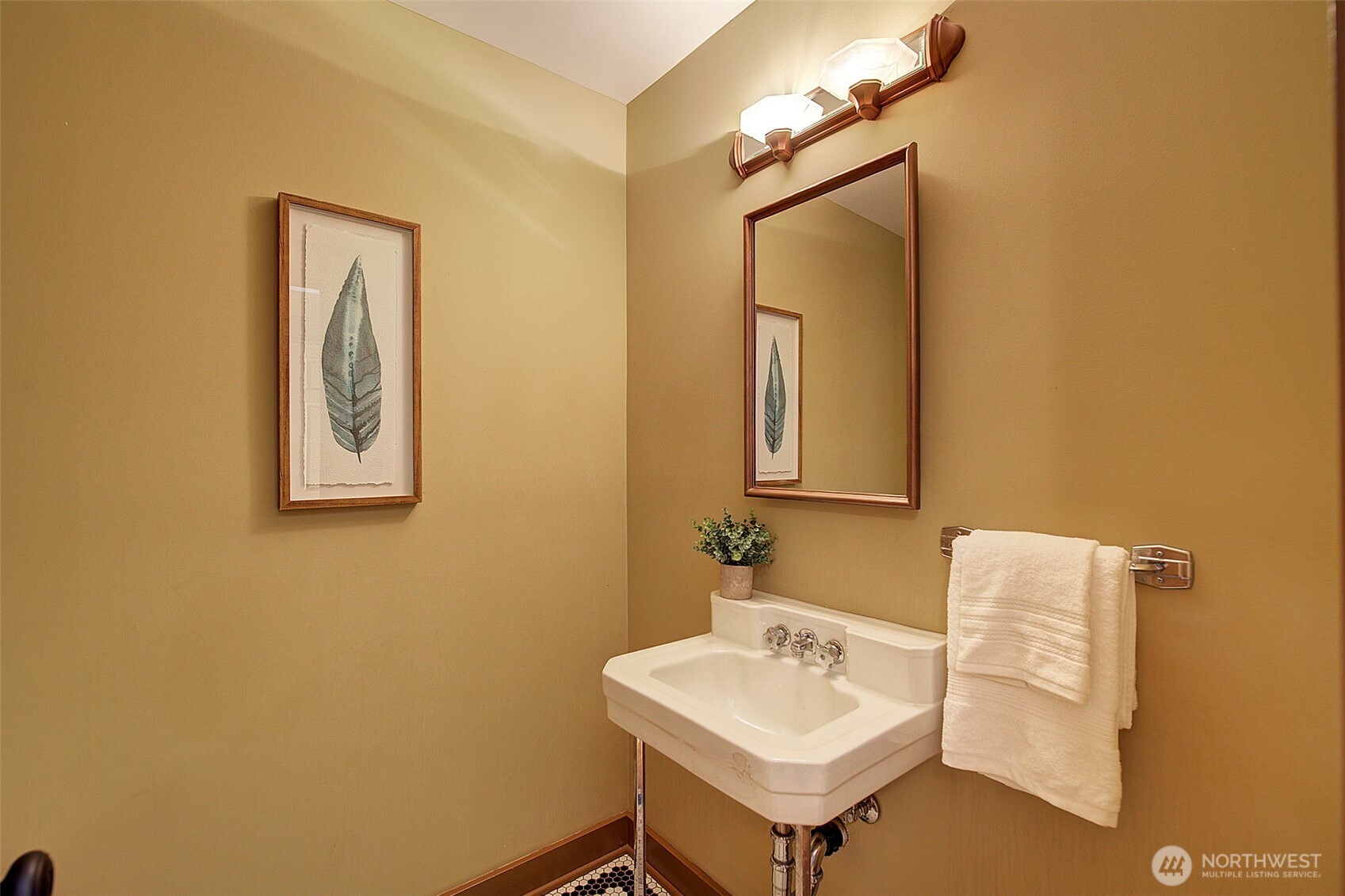 311 Northeast 117th Street Seattle, WA 98125 - Photo 17 of 40 a bathroom with a sink and a mirror