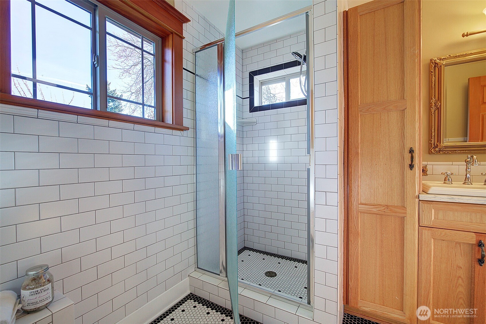 311 Northeast 117th Street Seattle, WA 98125 - Photo 22 of 40 a bathroom with a shower and a sink