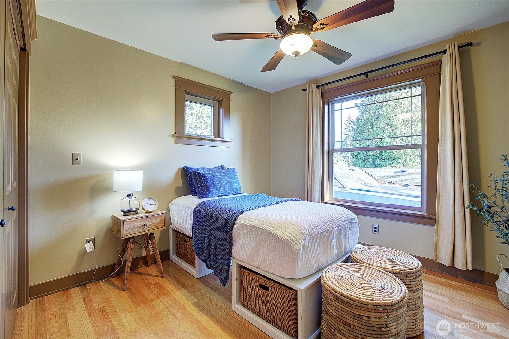311 Northeast 117th Street Seattle, WA 98125 - Photo 28 of 40 a bedroom with a bed and a window