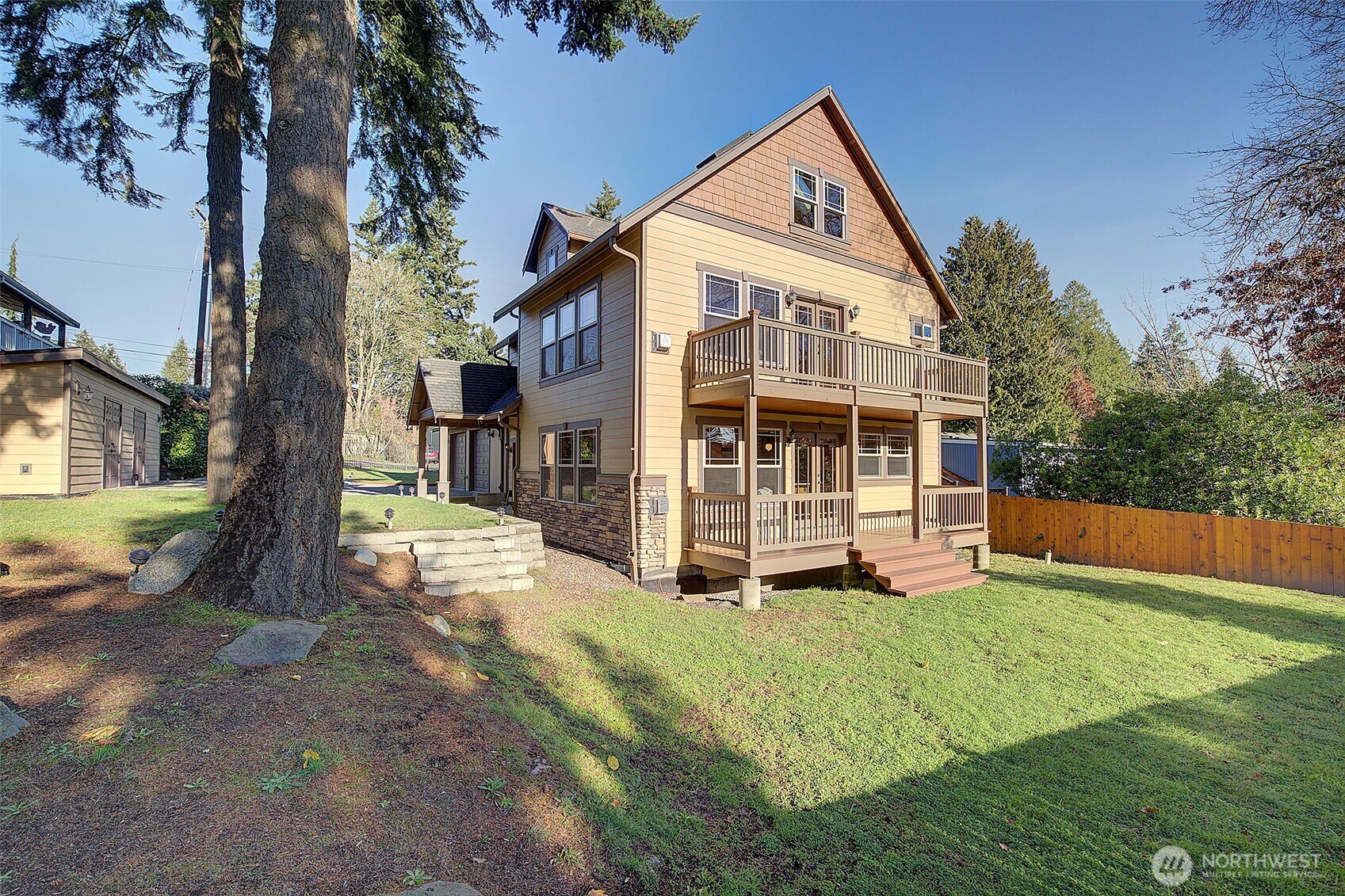 311 Northeast 117th Street Seattle, WA 98125 - Photo 36 of 40 a view of house with yard and swimming pool