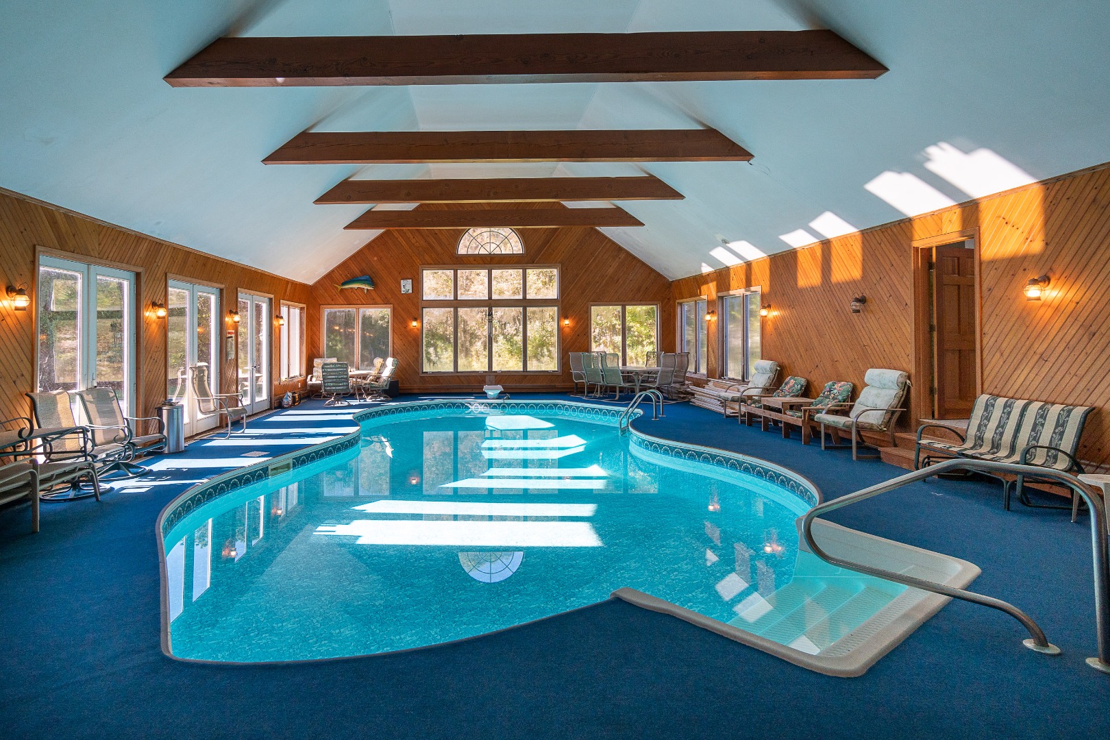 35 Pine Crest Drive Nantucket, MA 02554 - Photo 16 of 44 a view of a swimming pool with a table and chairs