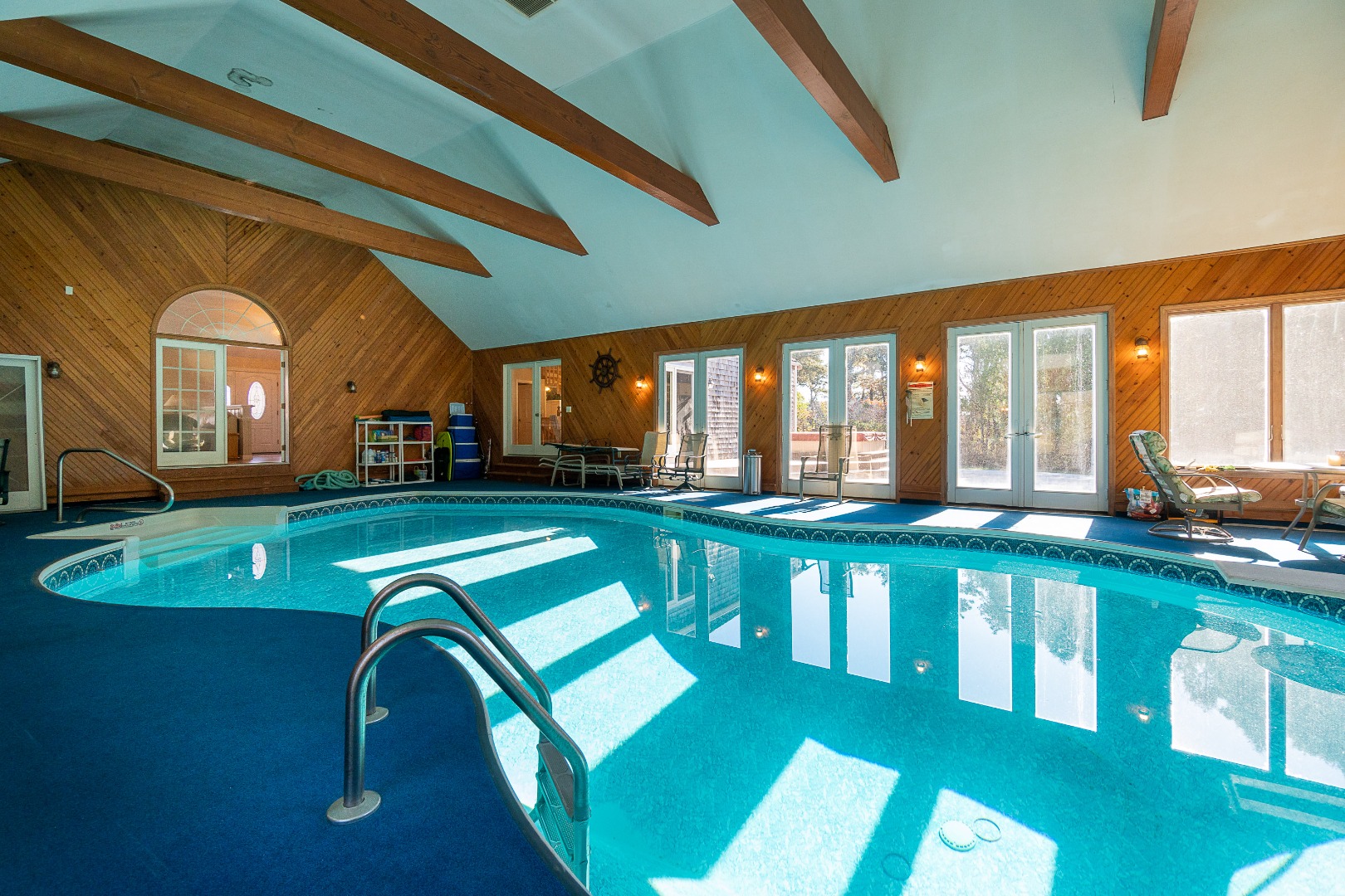 35 Pine Crest Drive Nantucket, MA 02554 - Photo 17 of 44 a view of a swimming pool with a lounge chairs
