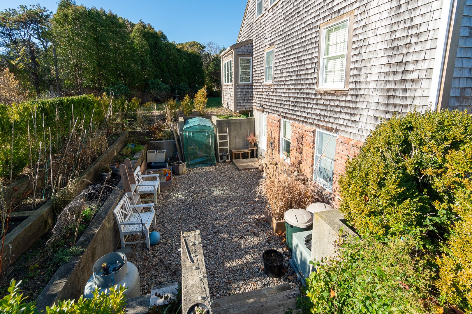 35 Pine Crest Drive Nantucket, MA 02554 - Photo 33 of 44 a backyard of a house with lots of green space