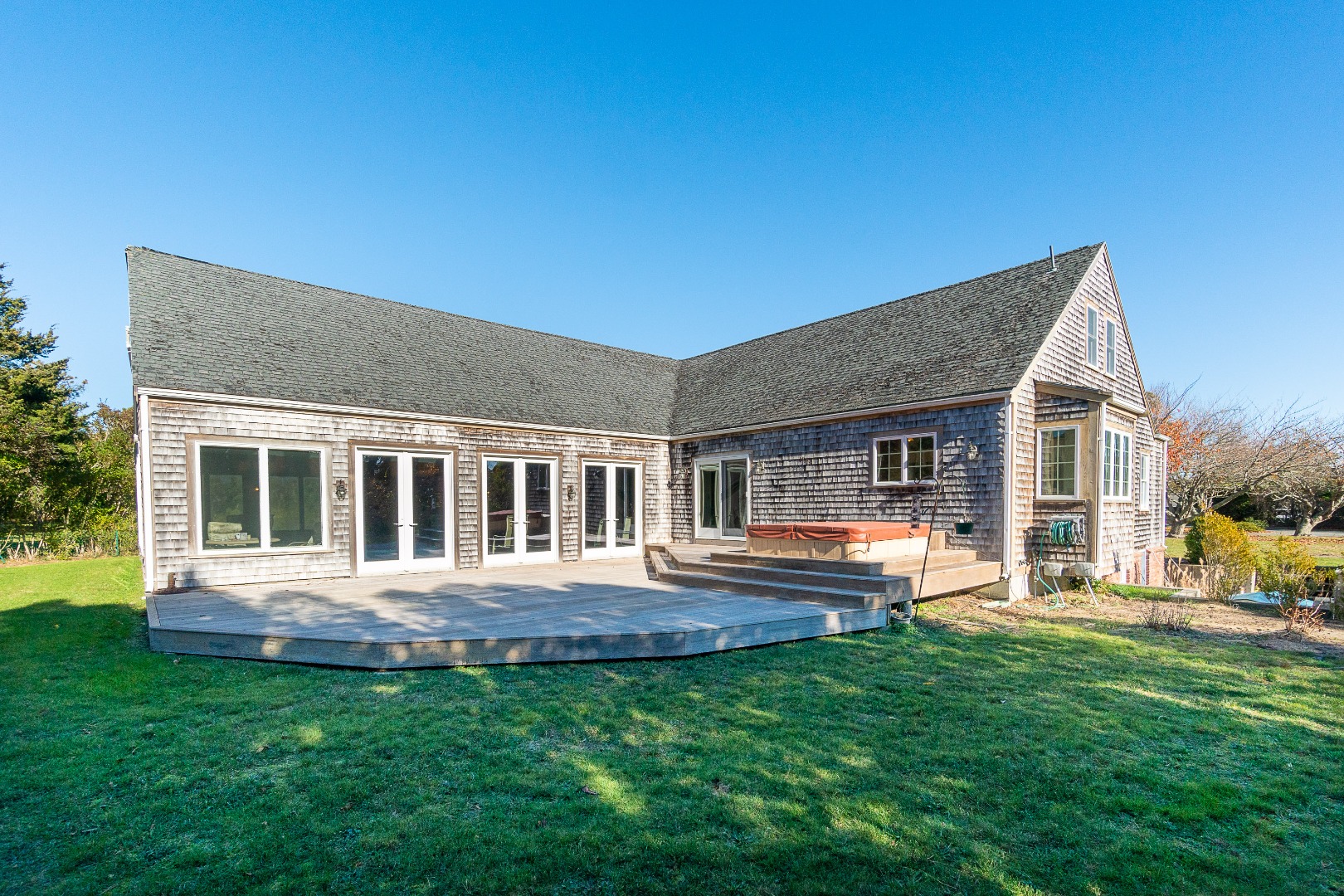 35 Pine Crest Drive Nantucket, MA 02554 - Photo 37 of 44 a front view of house with a garden and patio