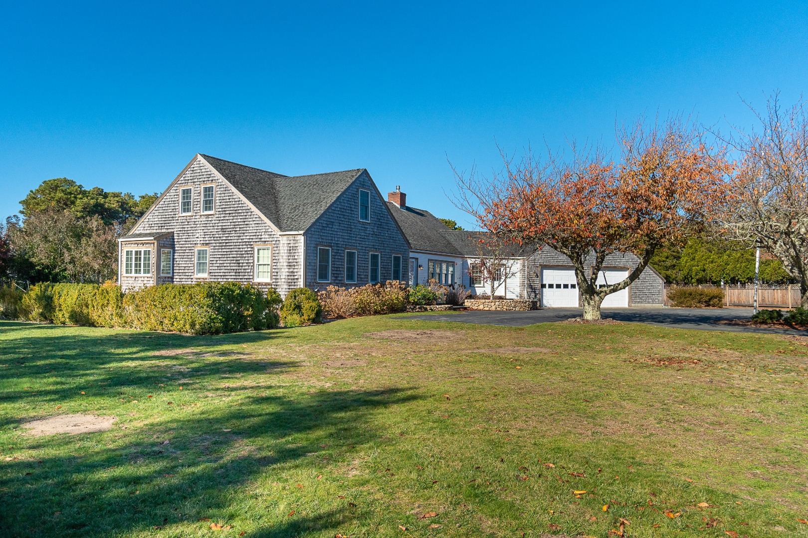 35 Pine Crest Drive Nantucket, MA 02554 - Photo 43 of 44 a front view of a house with a garden