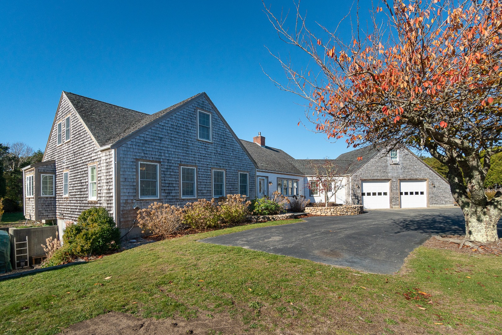 35 Pine Crest Drive Nantucket, MA 02554 - Photo 44 of 44 a front view of a house with a garden