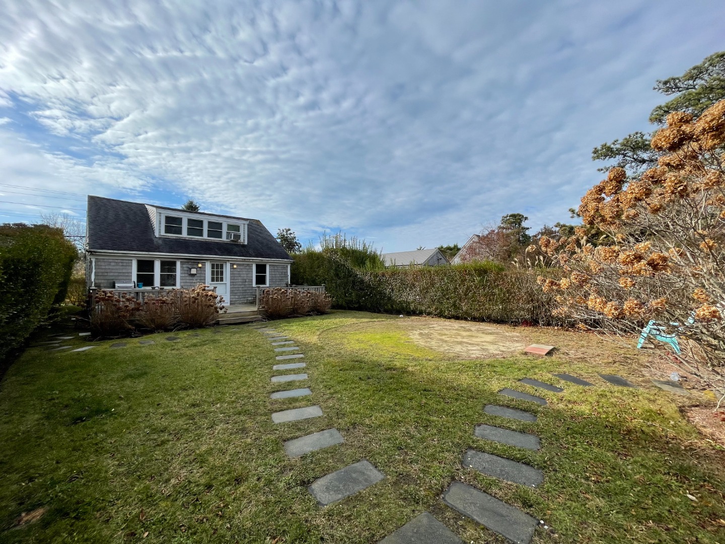 35 Pine Crest Drive Nantucket, MA 02554 - Photo 7 of 44 a front view of a house with a yard