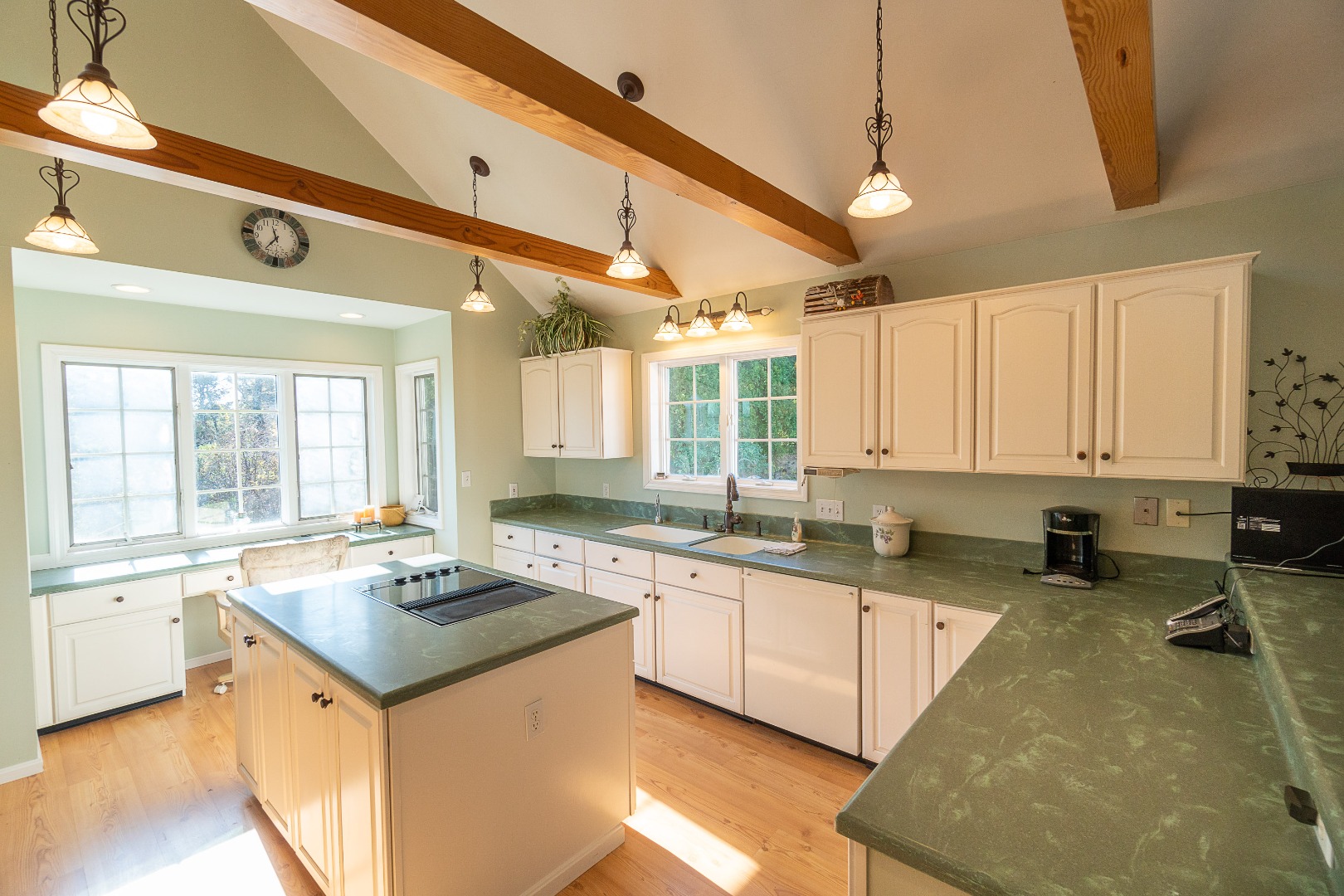 35 Pine Crest Drive Nantucket, MA 02554 - Photo 9 of 44 a kitchen with a sink stove and cabinets