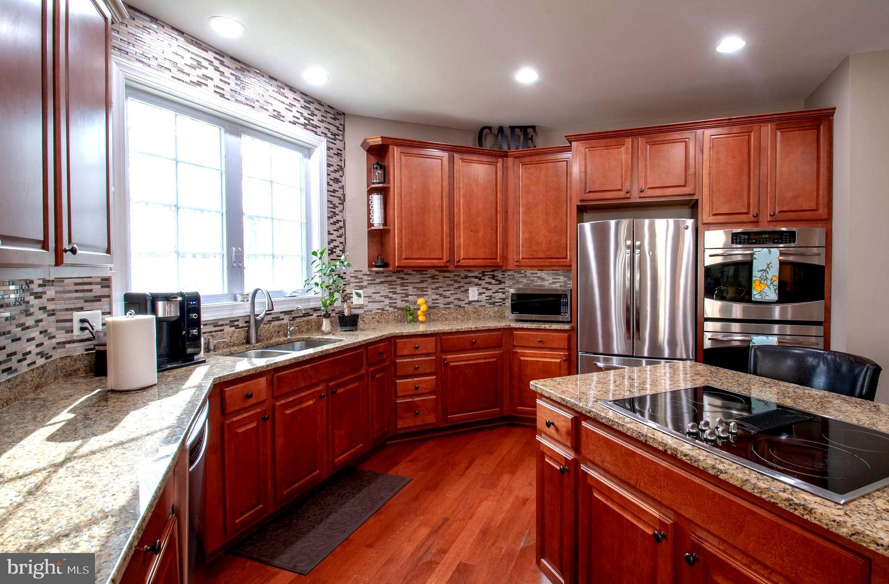 1490 Shot Town Road Annapolis, MD 21409 - Photo 13 of 40 Sleek Granite Counters and Cooktop Island